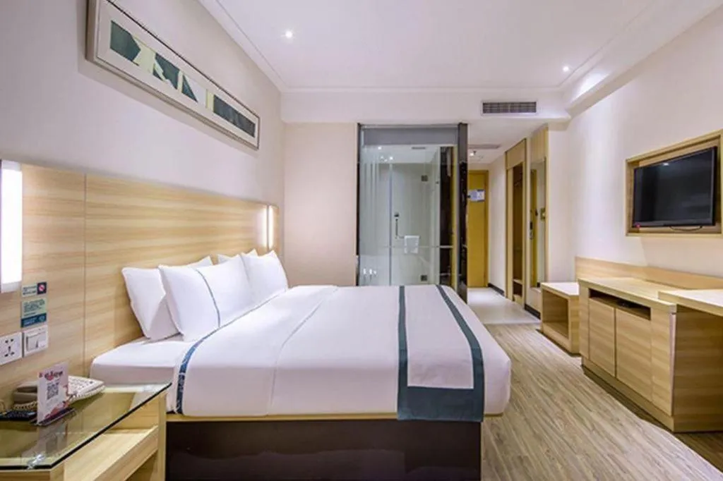 Bed in City Comfort Inn Zhongshan Shaxi Starbao Rosewood Expo City