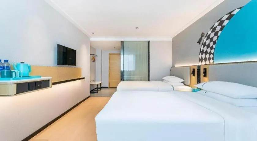 Bed in City Comfort Inn Zhongshan Shaxi Starbao Rosewood Expo City