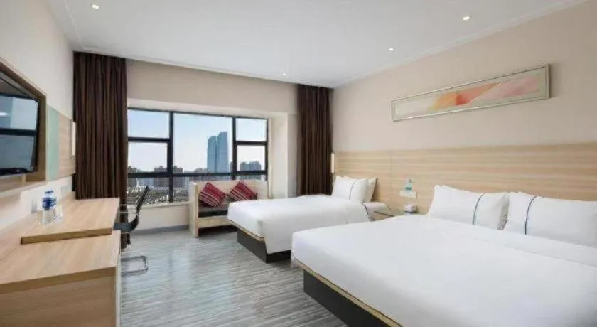 Bed in City Comfort Inn Zhongshan Shaxi Starbao Rosewood Expo City