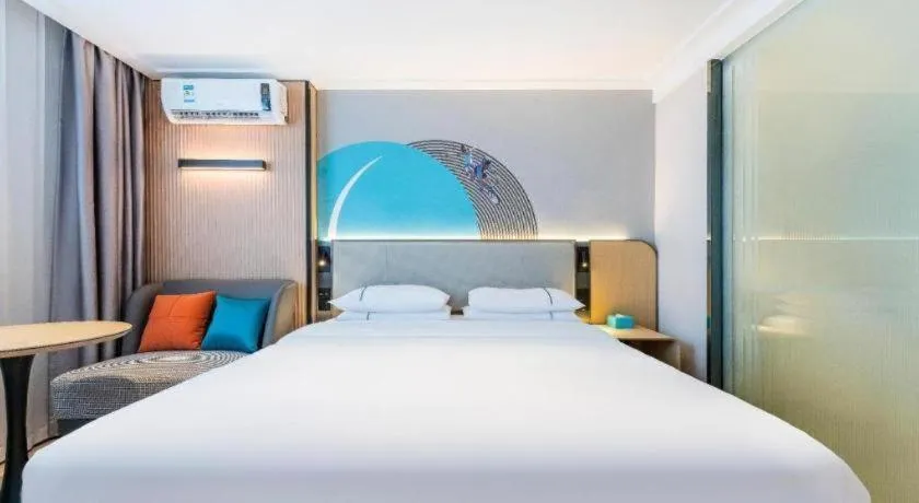 Bed in City Comfort Inn Zhongshan Shaxi Starbao Rosewood Expo City