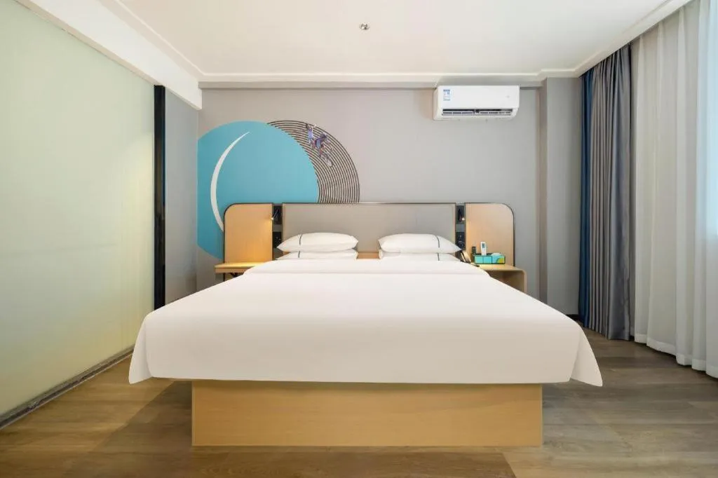 Bed in City Comfort Inn Wuzhou Wangcheng Square