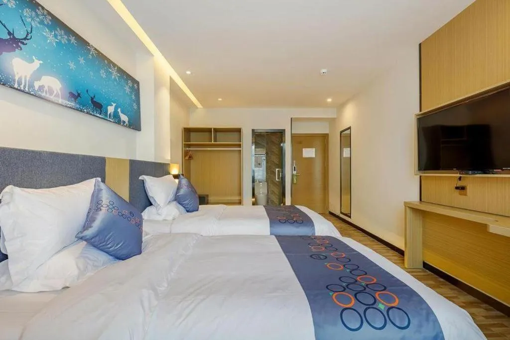 Bed in Yi Mi Hotel Shenzhen Longgang Pinghu South China City