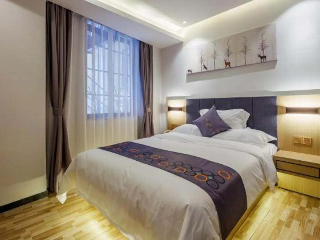 Bed in Yi Mi Hotel Shenzhen Longgang Pinghu South China City