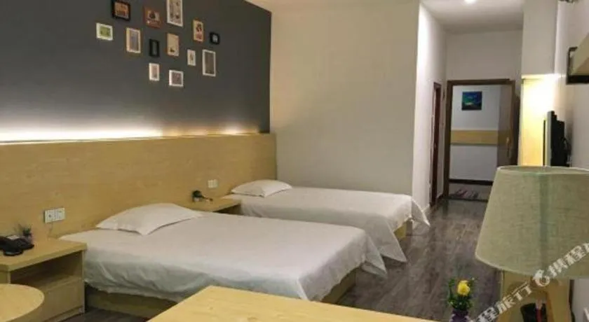 Bed in Yi Mi Hotel Shenzhen Longgang Pinghu South China City