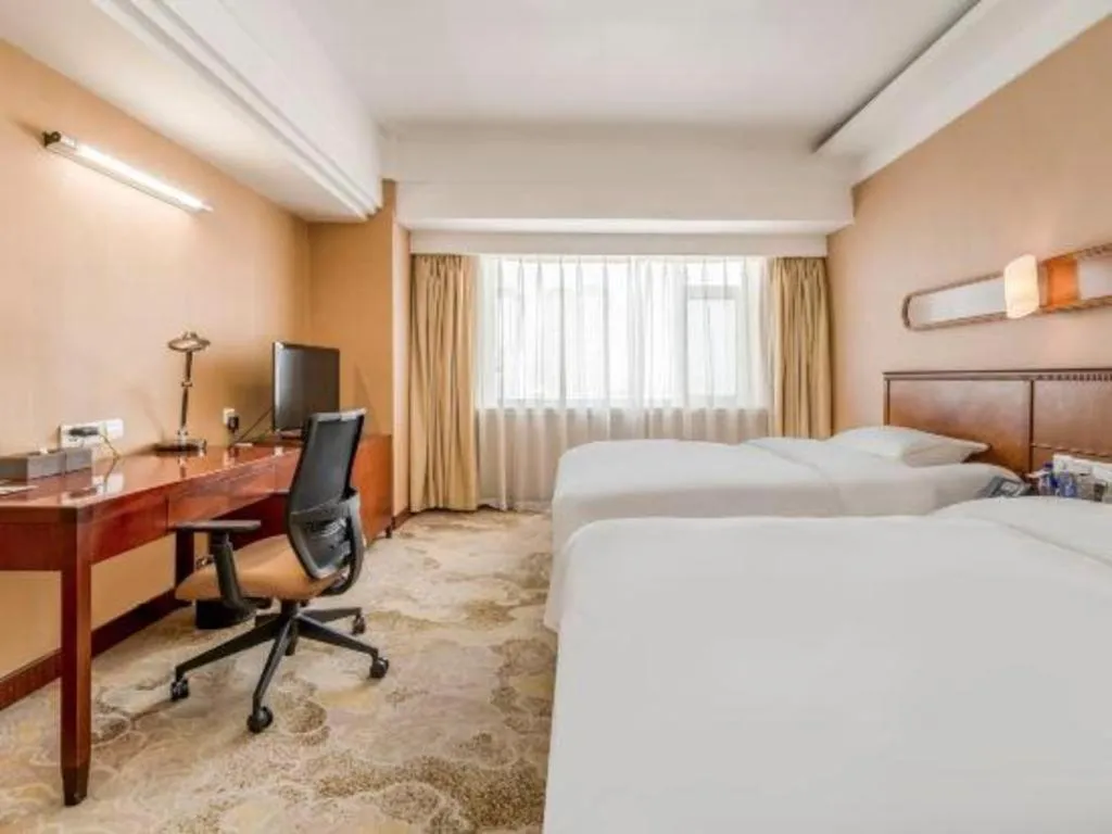 Bed in Yantai Bihai Hotel