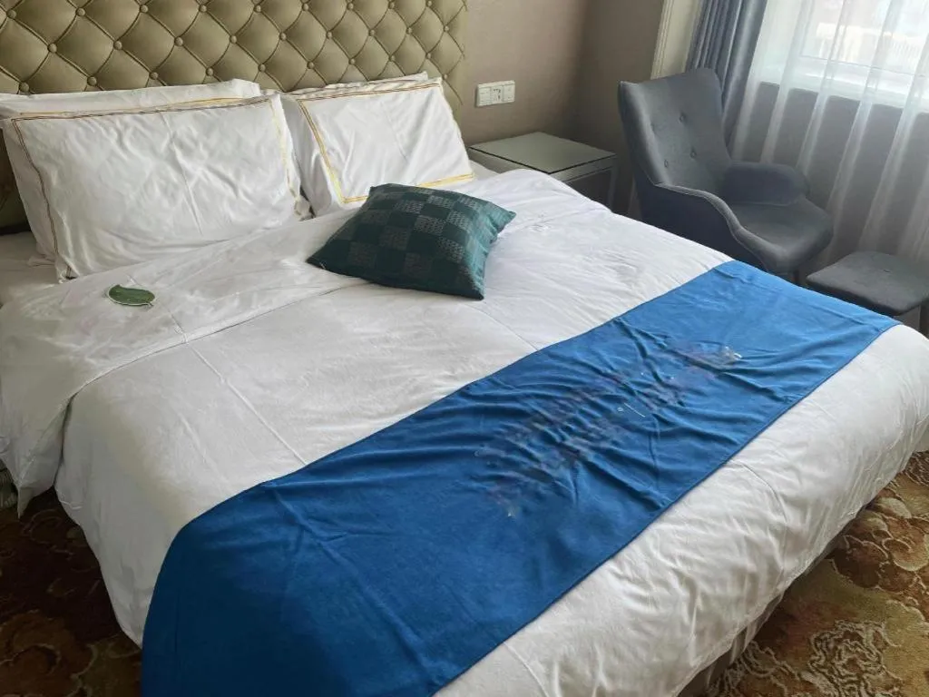 Bed in Yantai Bihai Hotel