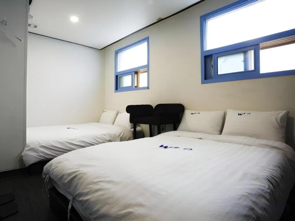 Bed in W Mini Hotel