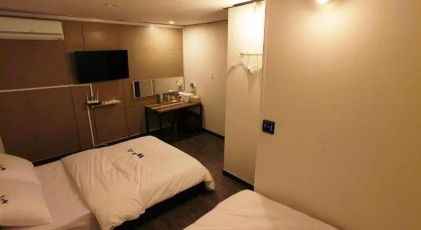Bed in W Mini Hotel