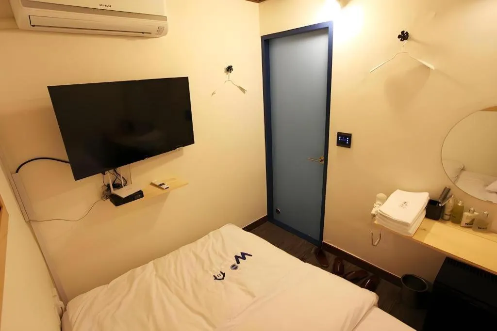 Bed in W Mini Hotel