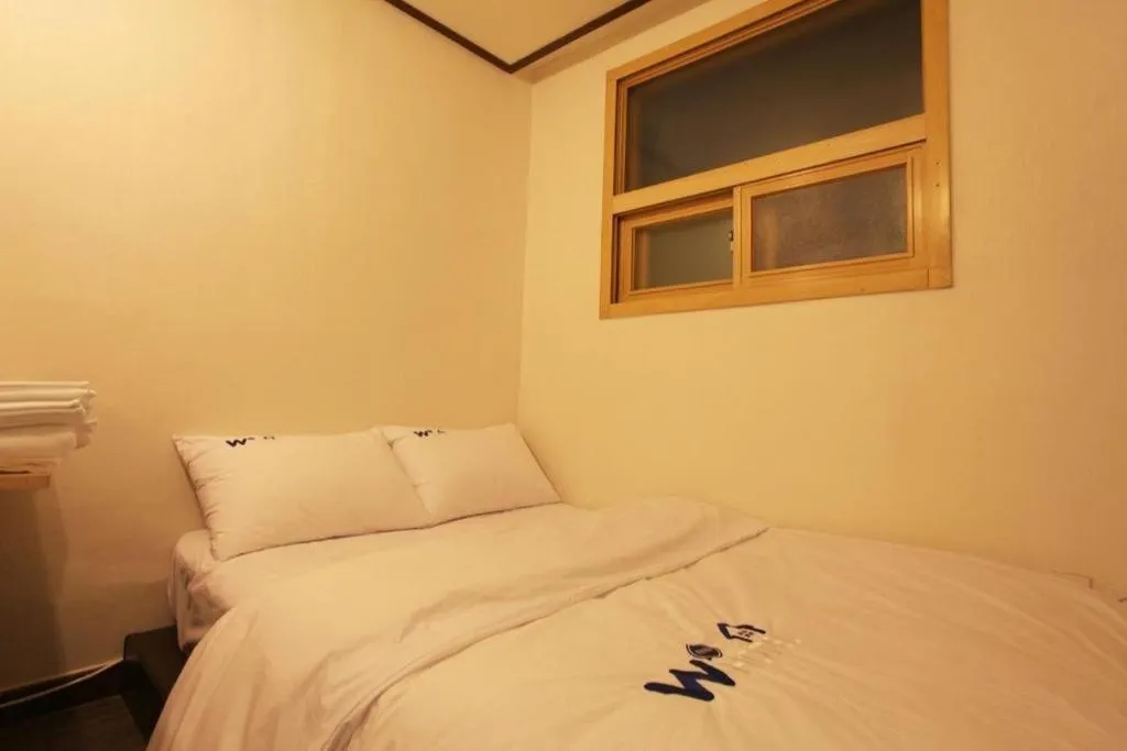 Bed in W Mini Hotel