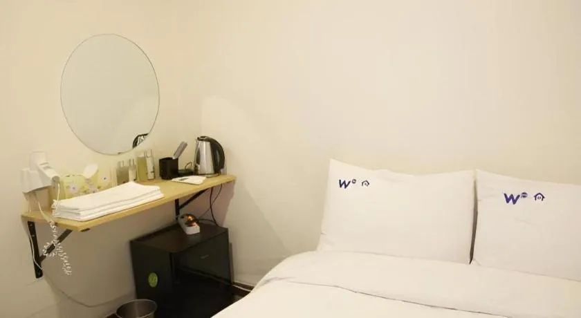Bed in W Mini Hotel