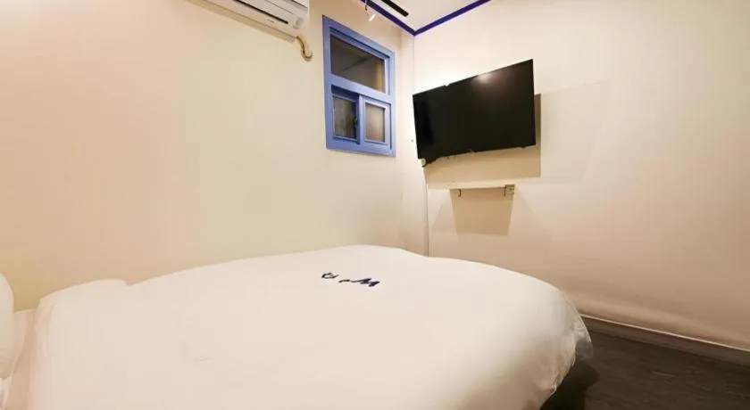 Bed in W Mini Hotel