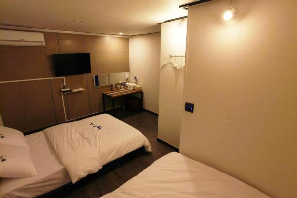 Bed in W Mini Hotel