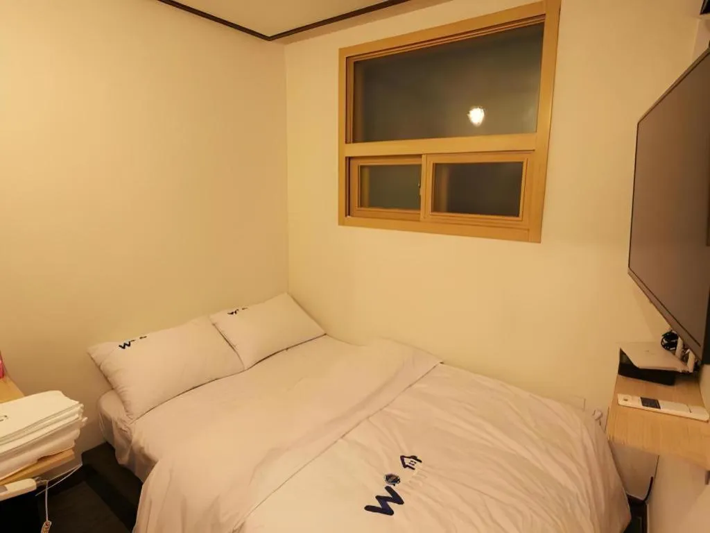 Bed in W Mini Hotel