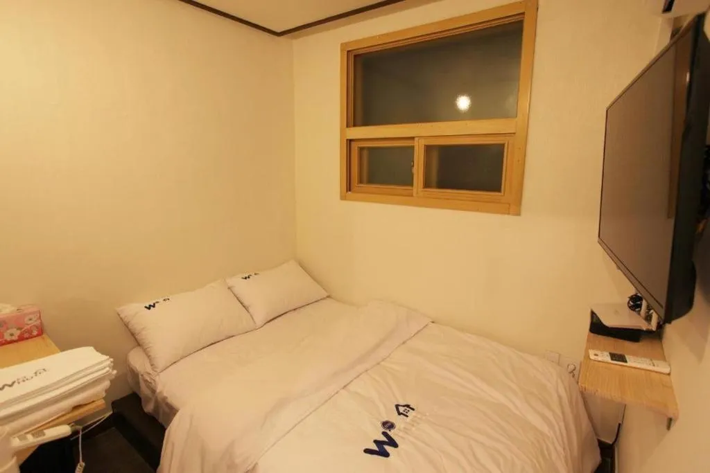 Bed in W Mini Hotel