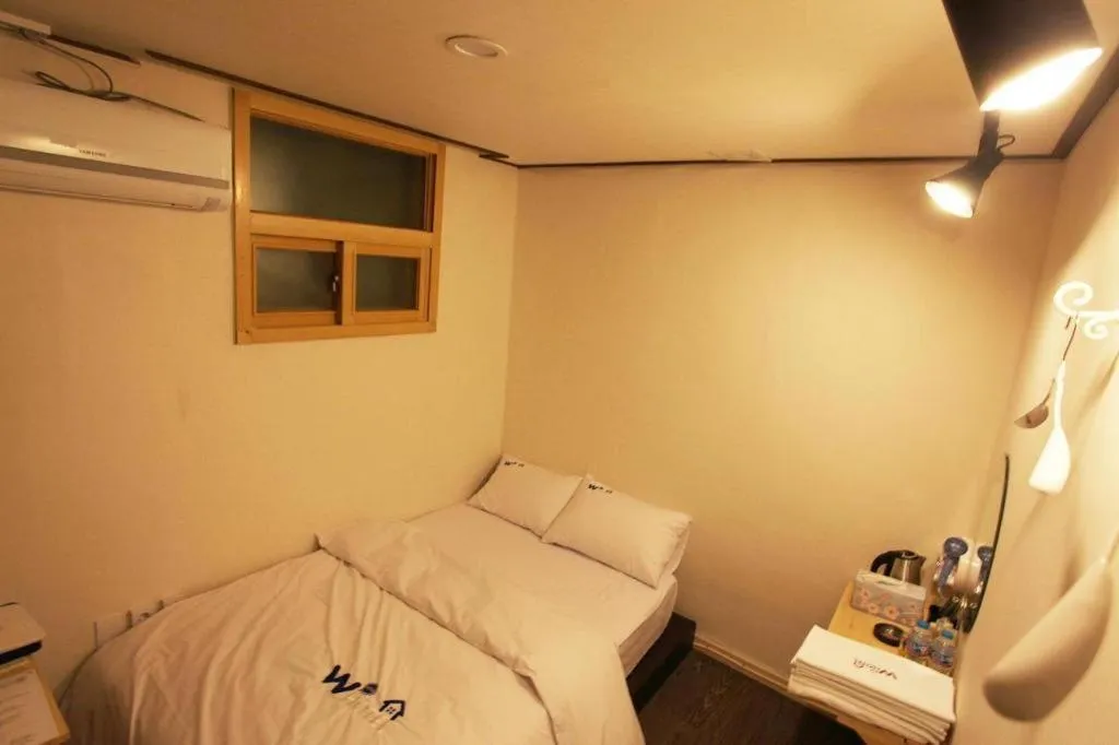 Bed in W Mini Hotel