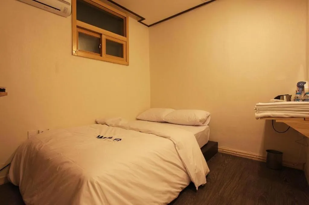 Bed in W Mini Hotel