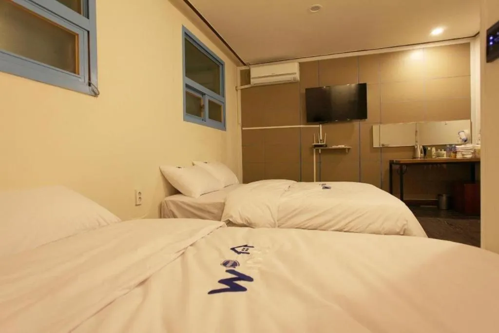 Bed in W Mini Hotel