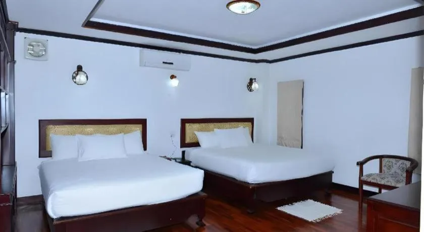 Bed in Anoulack Khen Lao Hotel