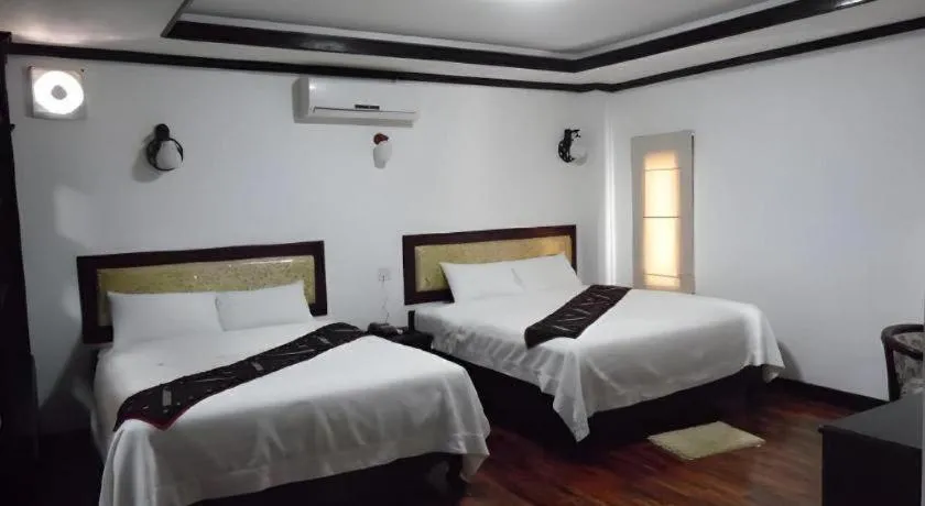 Bed in Anoulack Khen Lao Hotel