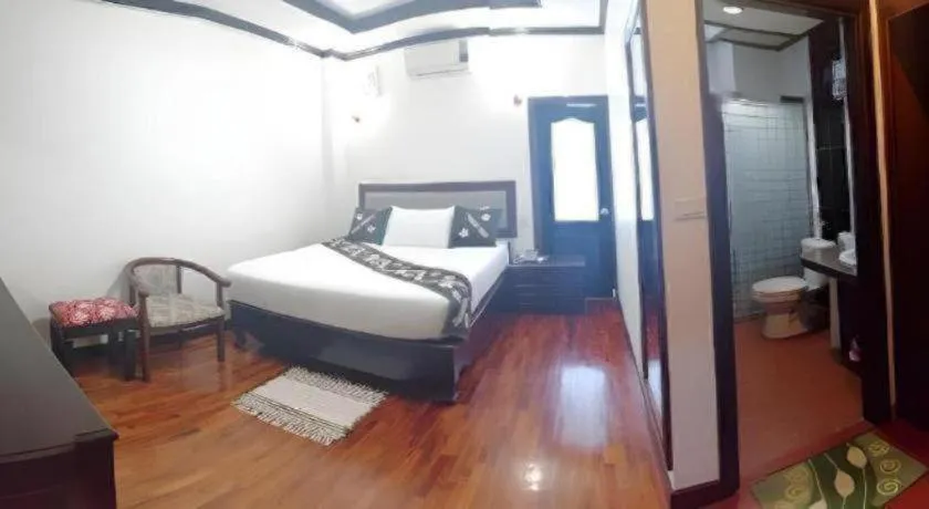 Bed in Anoulack Khen Lao Hotel