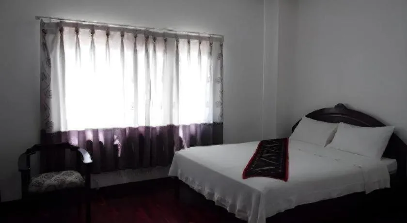 Bed in Anoulack Khen Lao Hotel