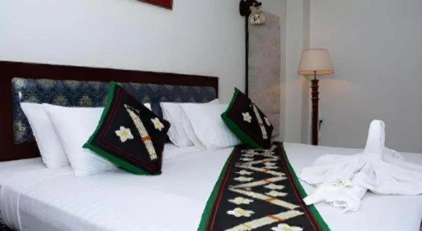 Bed in Anoulack Khen Lao Hotel