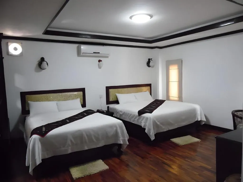 Bed in Anoulack Khen Lao Hotel