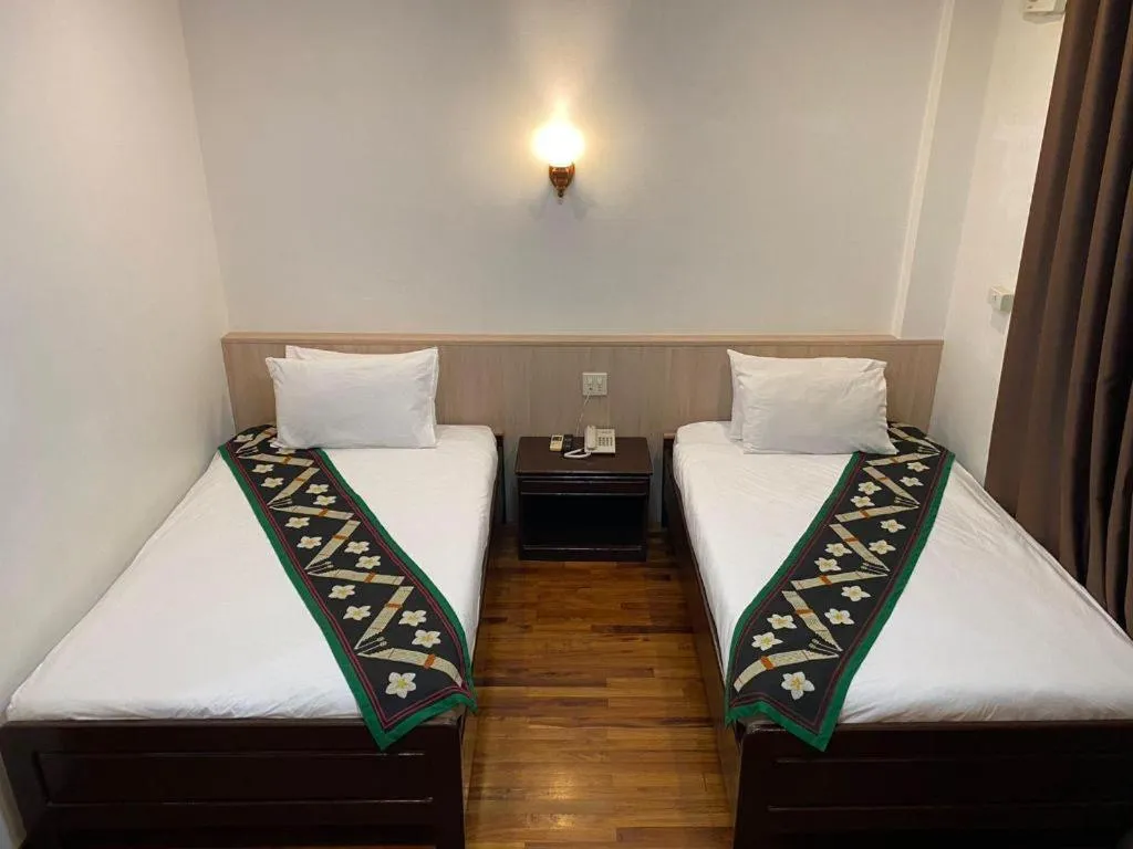 Bed in Anoulack Khen Lao Hotel