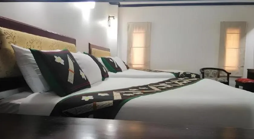 Bed in Anoulack Khen Lao Hotel