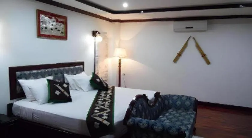 Bed in Anoulack Khen Lao Hotel