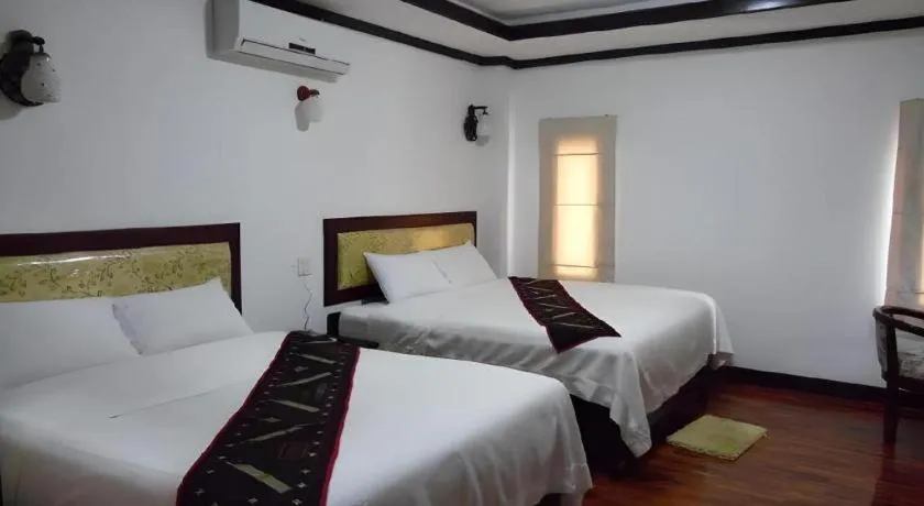 Bed in Anoulack Khen Lao Hotel