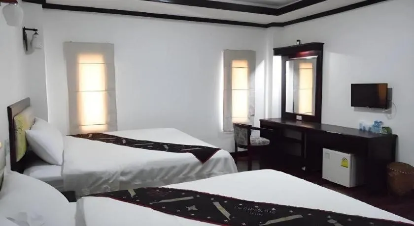 Bed in Anoulack Khen Lao Hotel