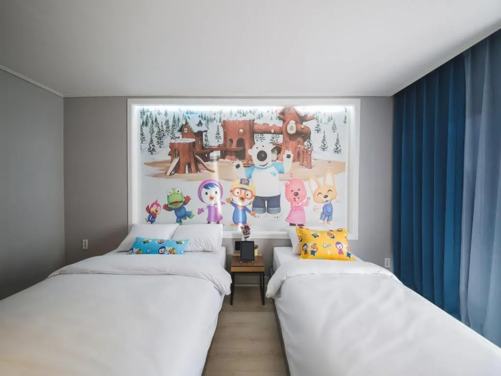 Bed in Sallys Jeju Hotel