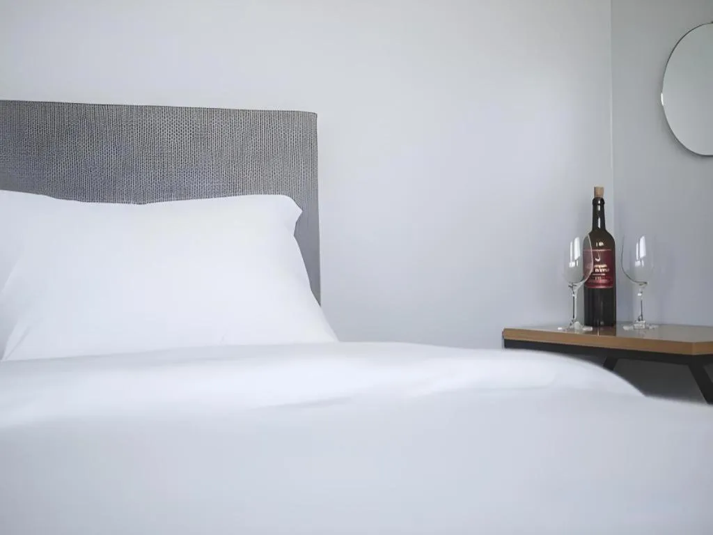 Bed in Sallys Jeju Hotel