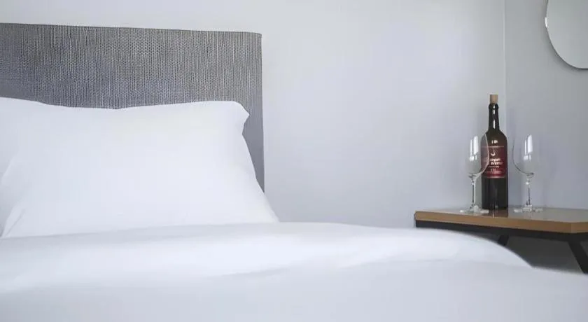 Bed in Sallys Jeju Hotel