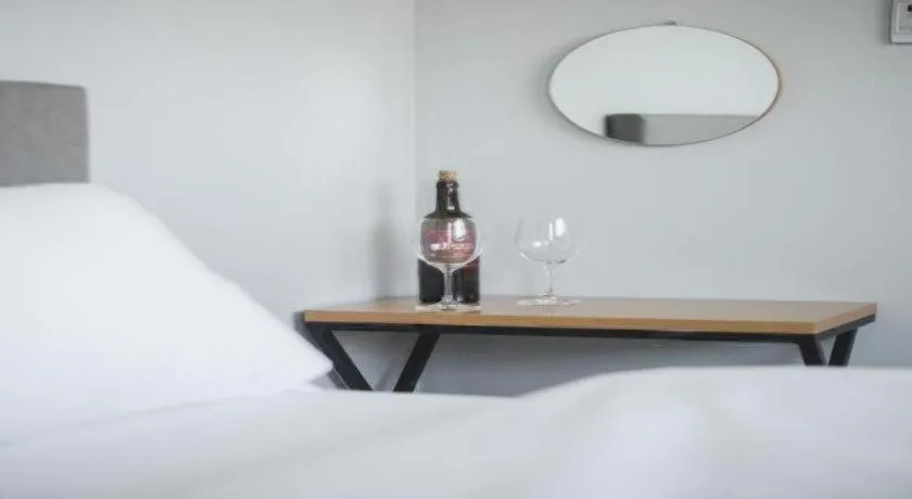 Bed in Sallys Jeju Hotel