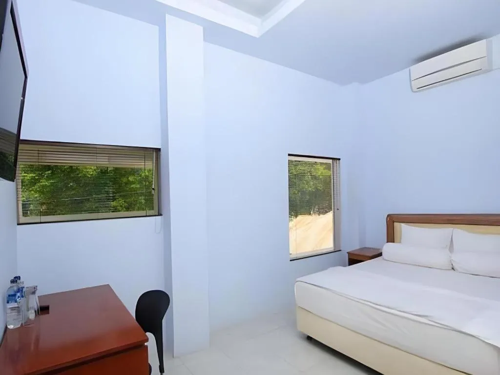 Bed in Hotel New Melati