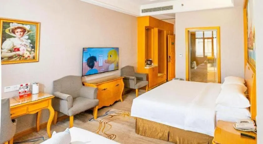 Bed in Vienna Hotel Shenzhen Longgang Dayun Center Branch