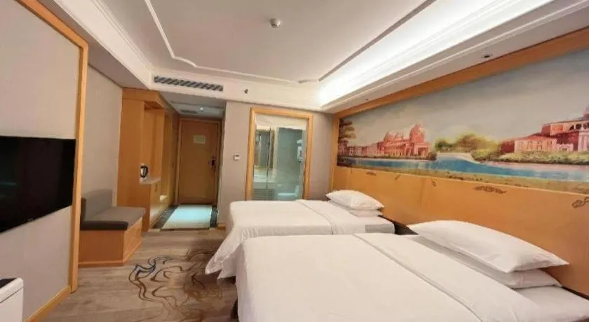 Bed in Vienna Hotel Shenzhen Longgang Dayun Center Branch