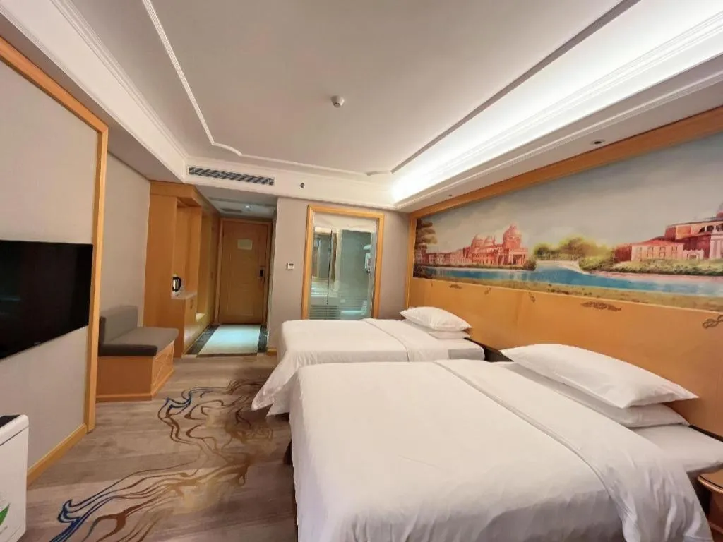 Bed in Vienna Hotel Shenzhen Longgang Dayun Center Branch