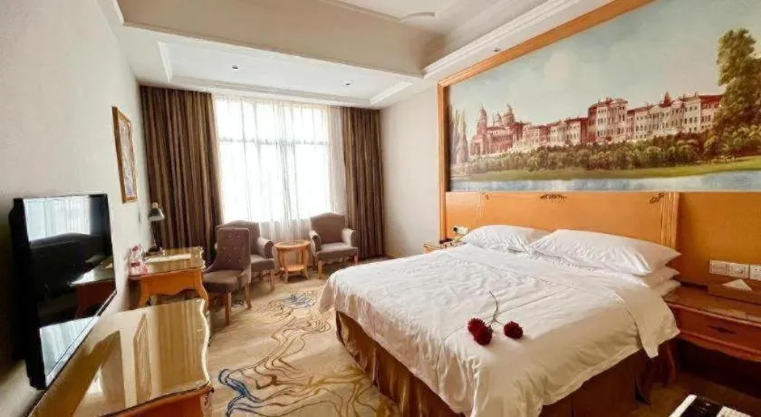 Bed in Vienna Hotel Shenzhen Longgang Dayun Center Branch