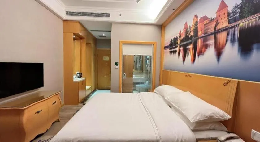 Bed in Vienna Hotel Shenzhen Longgang Dayun Center Branch