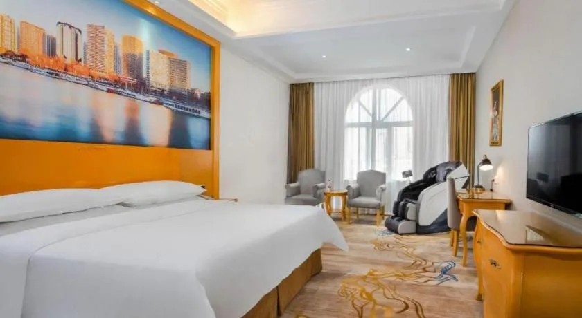Bed in Vienna Hotel Shenzhen Longgang Dayun Center Branch