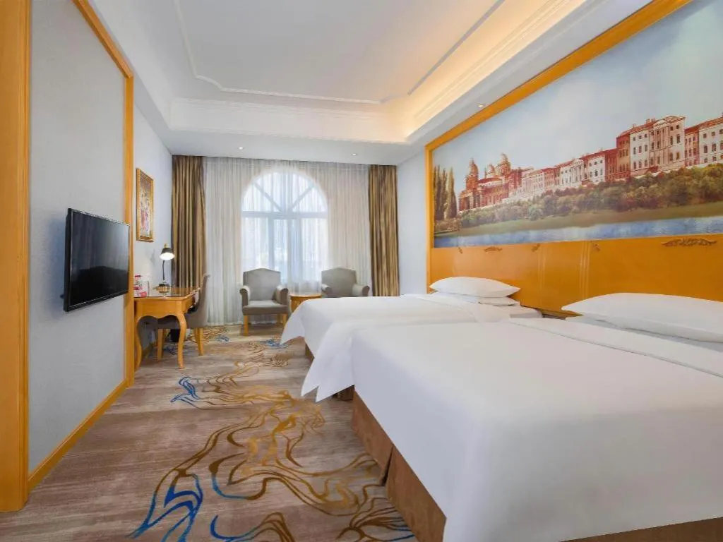 Bed in Vienna Hotel Shenzhen Longgang Dayun Center Branch