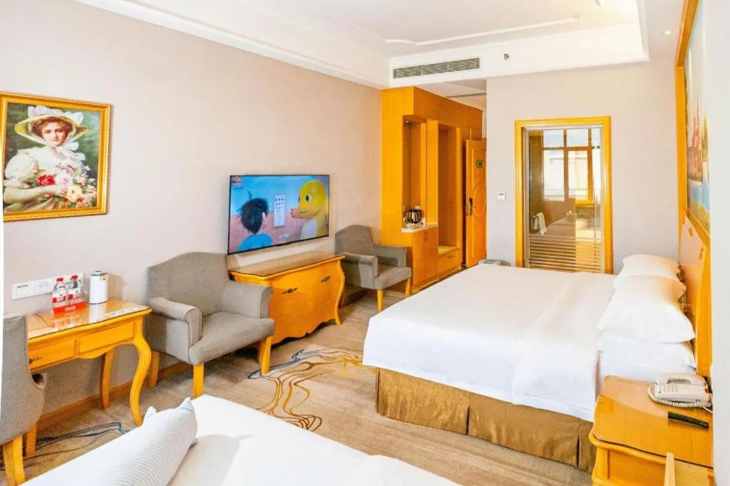 Bed in Vienna Hotel Shenzhen Longgang Dayun Center Branch