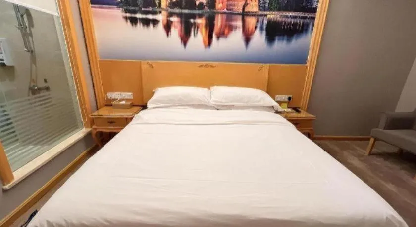 Bed in Vienna Hotel Shenzhen Longgang Dayun Center Branch