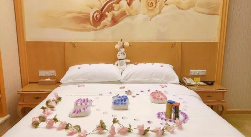 Bed in Vienna Hotel Shenzhen Longgang Dayun Center Branch