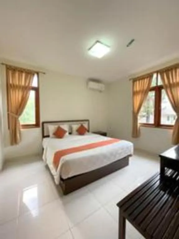 Bed in Ole Suite Hotel and Cottage