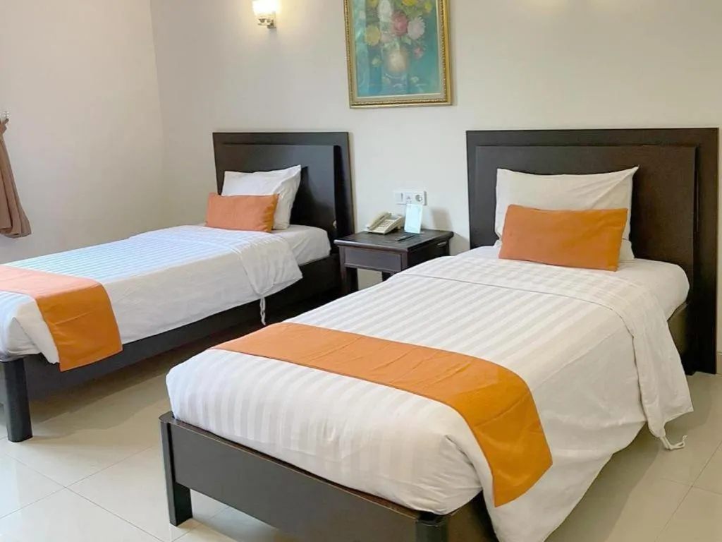 Bed in Ole Suite Hotel and Cottage